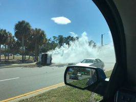 The pick-up truck that law enforcement was chasing overturned on Palm Coast Parkway near I-95, and its occupants fled. (© FlaglerLive)