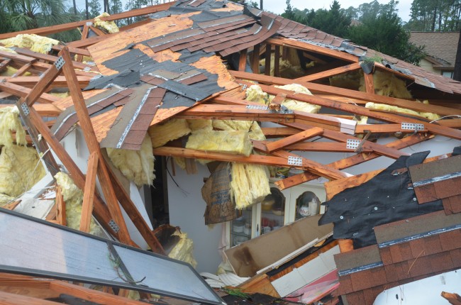 A house on Palm Coast's Barrenwrood Lane and Bayside Drive after the December 2013 tornado. (© FlaglerLive)