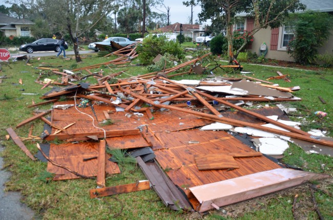 One roof ended up in a neighbor's yard across the street. Click on the image for larger view. (© FlaglerLive)