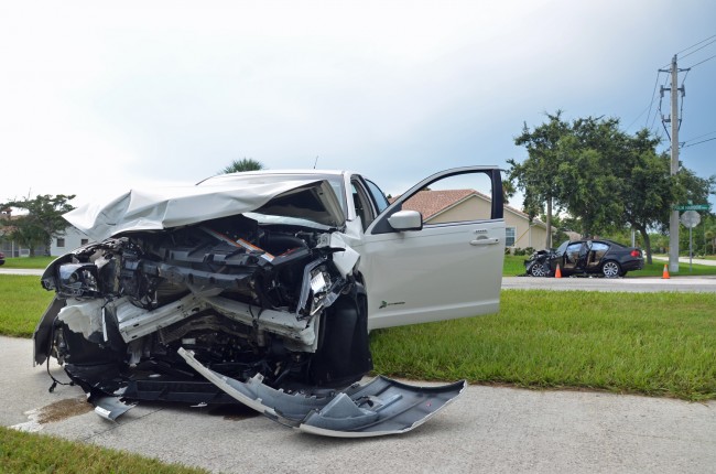 What was left of the Ford Fusion driven by 83-year-old David Quinn of Palm Coast. Click on the image for larger view. The BMW is in the background. (© FlaglerLive)