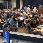 The crowd at this evening's school board meeting before the meeting started, and the pandemic sign was removed, in compliance with board rules. The meeting would get loud and raucous. (© FlaglerLive)