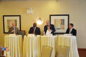 From left, County Commission Chairman Don O'Brien, Bunnell Manager Alvin Jackson, Flagler Beach Manager Larry Nedwsom, and Palm Coast Interim Manager Beau Falgout. (© FlaglerLive)