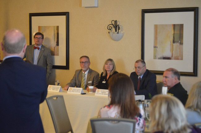 The seated panelists at this morning's Common Ground breakfast on education were, from left, Superintendent Jim Tager, Flagler Technical Institute Director Renee Stauffacher, and Daytona State College President Tom LoBasso. (© FlaglerLive)