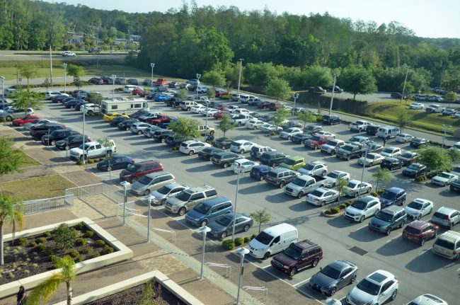 A jammed parking lot at the county courthouse reflected the 500-some potential jurors called in for selection today, three time the usual number. (c FlaglerLive)