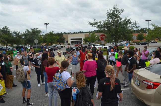 In the parking lot before the march. (© FlaglerLive)