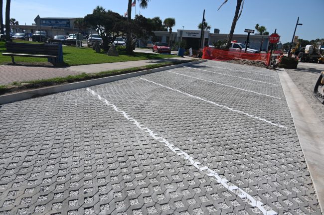 The parking spaces are back--enough to make you get down on your knees and kiss them. But they won;t long be vacant. (© FlaglerLive)