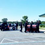 Deputy Paul Luciano's coffin as pallbearers approached First Baptist Church in Bunnell for this morning's service. (© FlaglerLive via FCSO video)