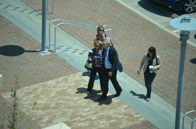 Paul Miller's last steps in freedom, around lunchtime, as he was walking back to the courthouse after a stop at Wendy's with his wife and daughter and one unidentified person. Click on the image for larger view. (© FlaglerLive)