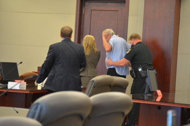 Miller was patted down and his belt and jacket removed before he was taken into custody. Click on the image for larger view. (© FlaglerLive)