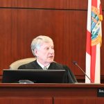 Circuit Judge Terence Perkins addressing the defense in a pre-trial on Tuesday, a day before his September retirement was announced: he will still preside over a few high-profile trials, including a murder trial beginning next Monday. (© FlaglerLive)