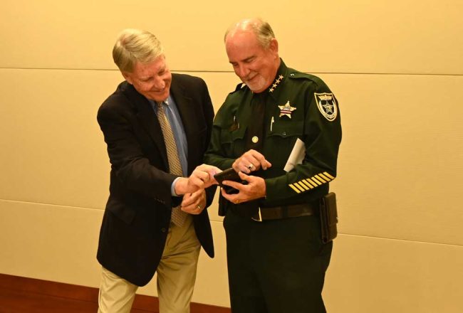 Bailiff for an evening: Sheriff Rick Staly with Circuit Judge Terence Perkins. (© FlaglerLive)