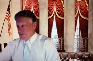 Circuit Judge Terence Perkins, with the U.S. Supreme Court's courtroom as backdrop, during today's Zoom hearing. (© FlaglerLive)