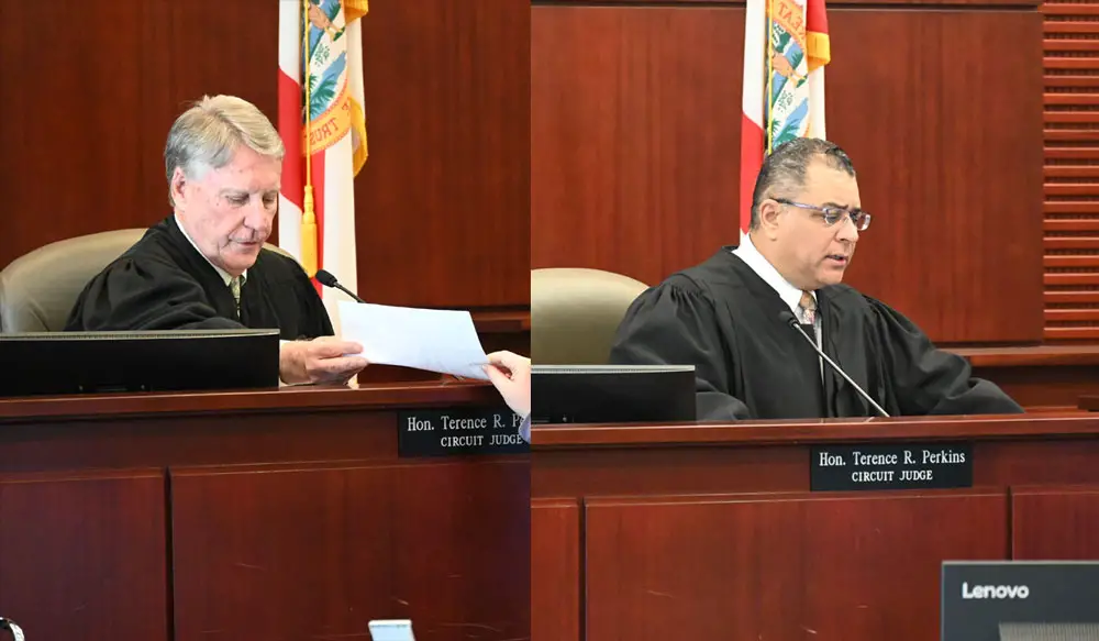 Circuit Judge Terence Perkins, left, handing a verdict to be read by the clerk at a recent trial in Bunnell, and Circuit Judge Raul Zambrano, who served as a felony judge in Flagler for a few years, sitting in for a hearing in Bunnell a few weeks ago. (© FlaglerLive)