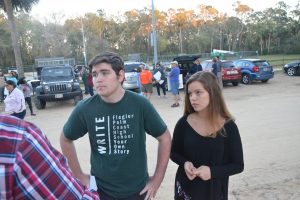 Tyler Perry, left, who organized the march, and Alyssa Santore, a member of the FPC student government, speaking with Matt Bruce of the News-Journal before the march. Click on the image for larger view. (© FlaglerLive)