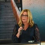 Flagler County Administrator Heidi Petito speaking at the celebration of life of her friend and colleague, Jorge Salinas, last October. (© FlaglerLive)
