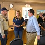 County Administrator Heidi Petito, center, with state Emergency Management Director Kevin Guthrie, left, and Flagler County Emergency Management Director Jonathan Lord last October, around the time she was celebrating the completion of her one-year anniversary as the permanent county administrator. (© FlaglerLive)