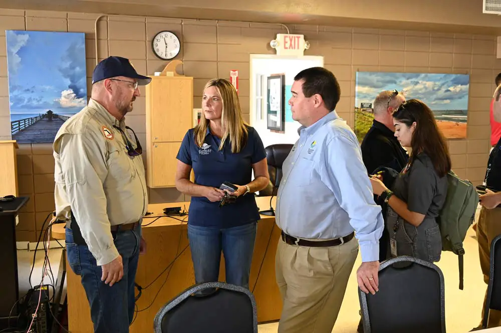 County Administrator Heidi Petito, center, with state Emergency Management Director Kevin Guthrie, left, and Flagler County Emergency Management Director Jonathan Lord last October, around the time she was celebrating the completion of her one-year anniversary as the permanent county administrator. (© FlaglerLive)