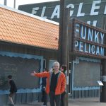 Philippe Waked of San Antonio, Texas, with his sister Danielle, of Montreal, behind him, outside the Funky Pelican some years ago. (© FlaglerLive)