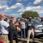 Mark Philips, foreground left, speaking to the group his "Flagler Liberty Coalition" took to Washington, D.C., for the Jan. 6 Trump rally that devolved into an assault on the Capitol. The trip was sponsored by County Commissioner Joe Mullins, in the red cap to Philips's left. The trip was preceded by a "security briefing" provided by Flagler County Sheriff Sgt. Mike Lutz. The still is from a video of the briefing.