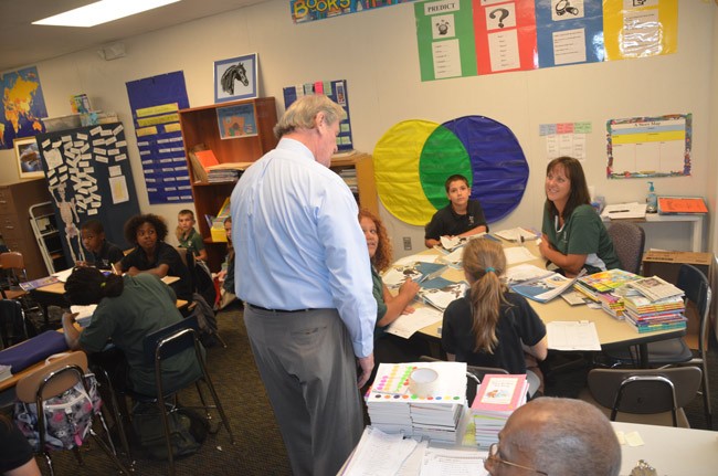 Phoenix Academy at its zenith, in May 2012, when it was showcased for then-Sen. John Thrasher, seen here speaking with students in Sue Noble's classroom. Phoenix will close and 'transition' to Wadsworth Elementary's STEM Academy. (© FlaglerLive)