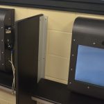 It can get expensive. The phones above are part of a video-phone bank at the county jail that does not charge for use. (© FlaglerLive)