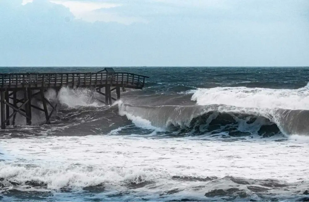 The ocean was already knocking at the pier again this morning. The pier, wrecked by Hurricane Ian, may lose yet more parts in this storm. (© Scott Spradley for FlaglerLive.)