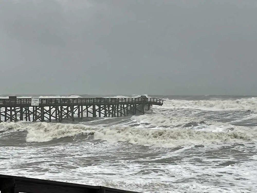 The Flagler Beach pier appeared to have survived the night without losing more limbs. (© Rick Belhumeur for FlaglerLive)