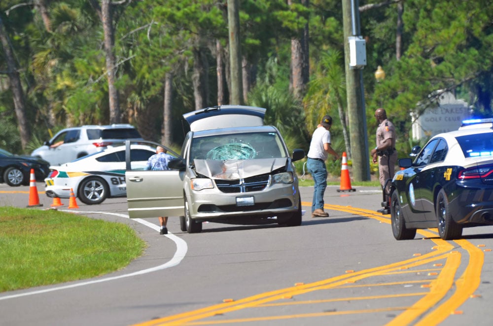 A minivan struck a pedestrian on Pine Lakes Parkway in Palm Coast this morning. (© FlaglerLive)