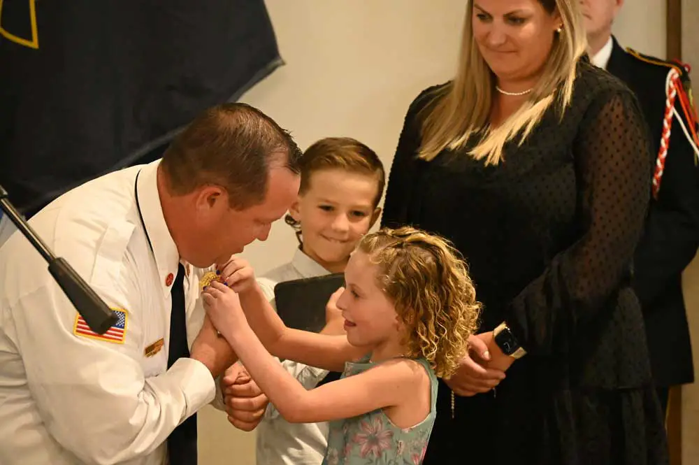 Kyle Berryhill's daughter Claire and his son James, with his wife Danielle, during the pinning of Chief Berryhill's badge after he was sworn-in. (© FlaglerLive)