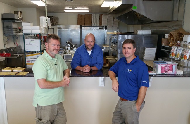 The ceaseless restaurateurs: from left, Chris Zwirn, Joe Rizzo, and new partner Trevor Tucker, whose building on County Road 305 is home to Pit Stop Pizza. 