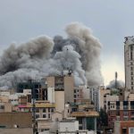 A plume of smoke rises after a strike in Tehran on March 2, 2026.