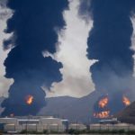 Plumes of smoke and fire rise after debris from an intercepted Iranian drone struck an oil facility, according to authorities, in Fujairah, United Arab Emirates, on March 14, 2026.