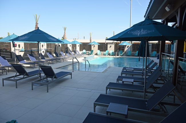 Poolside. You can almost imagine State Road 100 isn't on the other side of those slatted walls. (© FlaglerLive)