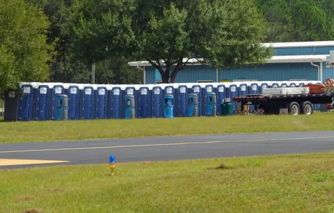 Portable toilets set up at the county airport in preparation for an expected (or wished for) onslaught of Florida Power and Light personnel and contracted linemen, who are staging at the airport. (© FlaglerLive)
