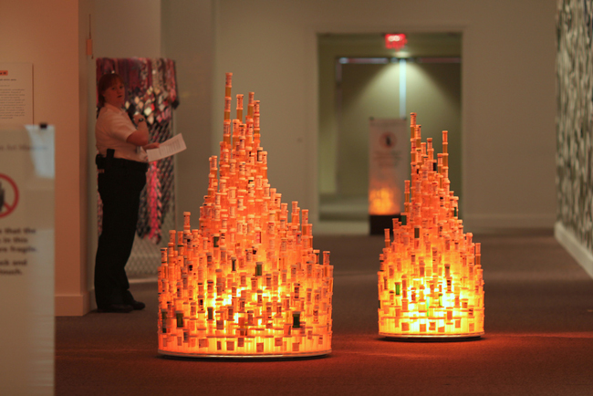 A detail from Jean Shin's 'Chemical Balance' installation at the Smithsonian, showing prescription pill bottles collected from nursing homes and arranged like stalagmites. Pill bottles similarly fall from the ceiling like stalactites, not shown in the image. (Mr. TinDC)