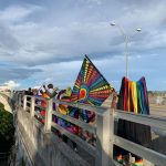 Flagler's second Pride march as it set off over the Flagler Beach bridge Saturday evening, before a vigil at Veterans Park on the other side. (© FlaglerLive)