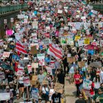 Demonstrators march in Washington, D.C., on Sept. 6, 2025, to protest President Donald Trump’s use of federal law enforcement and National Guard troops in the nation’s capital.