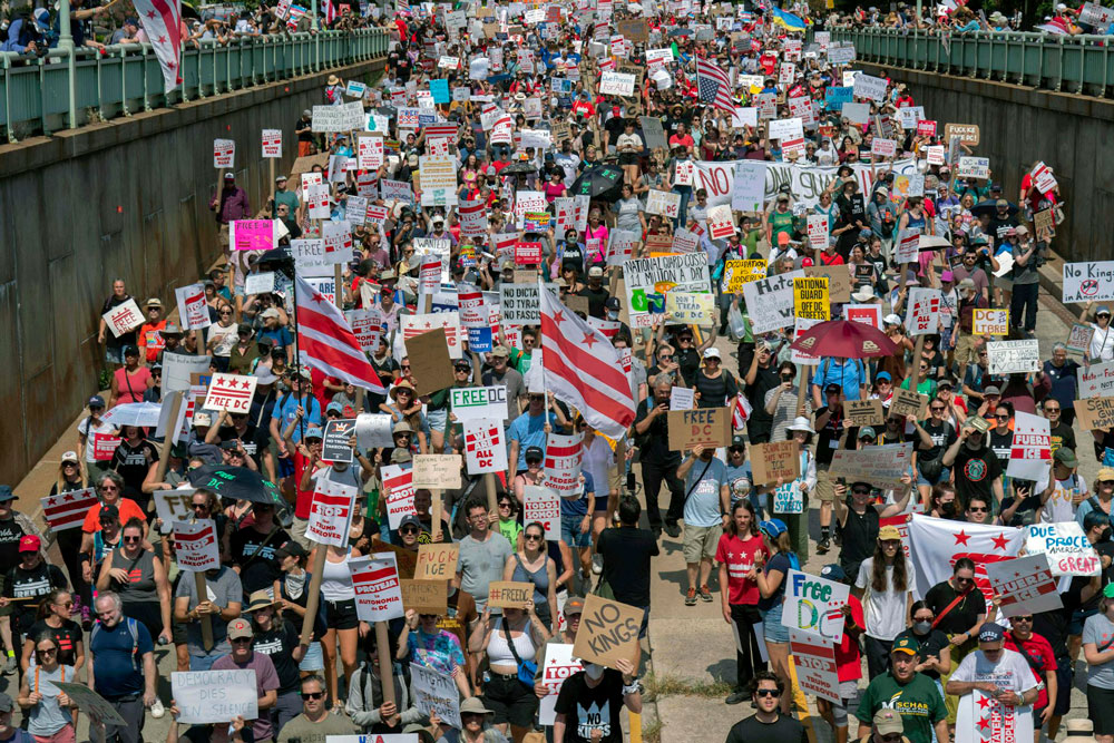 Demonstrators march in Washington, D.C., on Sept. 6, 2025, to protest President Donald Trump’s use of federal law enforcement and National Guard troops in the nation’s capital.