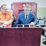 George Proulx, left, with his attorney, Michael Lambert, appearing before Circuit Judge Dawn Nichols. Proulx was sentenced to an additional four years in prison for violating his probation a year after he'd been released from state prison. (© FlaglerLive via zoom)