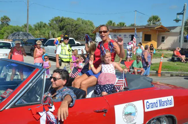 Mayor Linda Provencher as Grand Marshal of Flagler Beach's 2016 July 4 parade. She was re-elected without opposition. Click on the image for larger view. (© FlaglerLive)