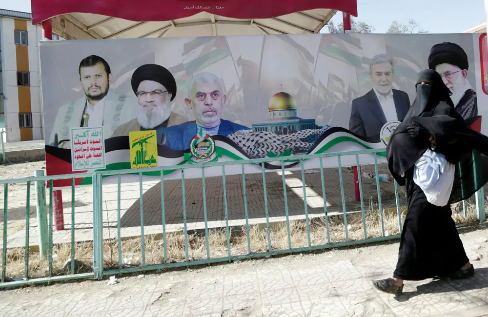 A billboard depicts the leaders of the Houthis, Hezbollah, Hamas, Islamic Jihad and Iran’s Ayatollah Ali Khamenei. 