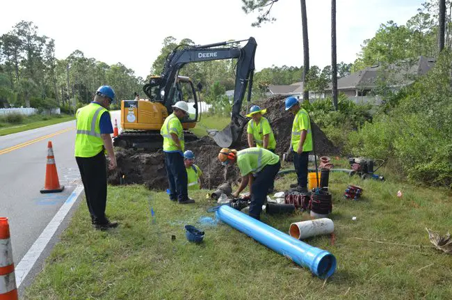 A city crew was working to repair the water issue on Rymfire Drive, near Ryan Drive, in mid-afternoon today. (c FlaglerLive)