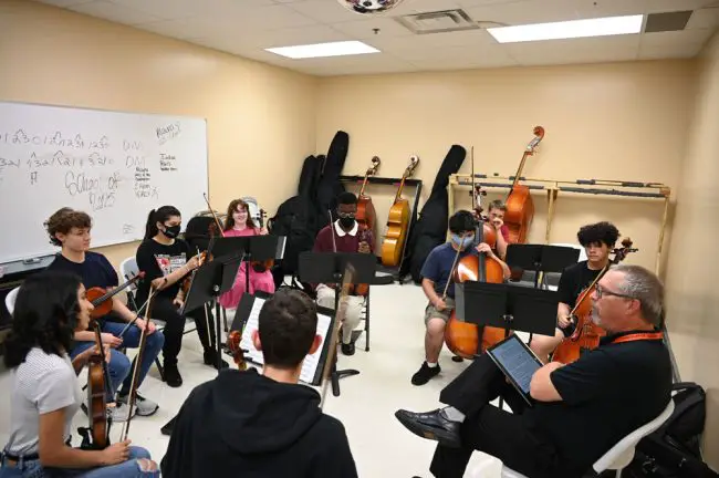 The FYO Quartet and back-up performers, the organization's most visible ensemble--it performs about a dozen times around the county each year, in addition to regularly scheduled concerts--in cramped but workable quarters as it rehearsed last week with conductor Joe Corporon. (© FlaglerLive)