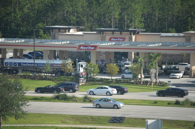 The mega Race Trac gas station at State Road 100 and Seminole Woods Boulevard near I-95, late Tuesday afternoon, with a fuel truck emptying its cargo, was busy fueling up cars, many of them heading home to South Florida. (c FlaglerLive)