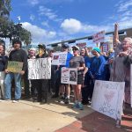Anti-Trump protesters stand in front of the Florida Historic Capitol on Feb. 5, 2025. (Photo by Jackie Llanos/Florida Phoenix)