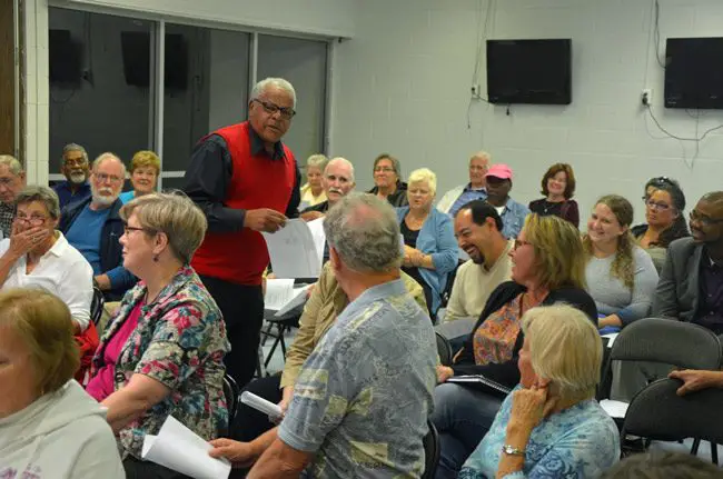 Ralph Lightfoot, center, diagnosing the worst electoral season for Democrats in Flagler County's history at the All Flagler Democratic Club meeting on Nov. 23 at the Palm Coast Community Center. The audience, however, was looking for strategy. (© FlaglerLive)