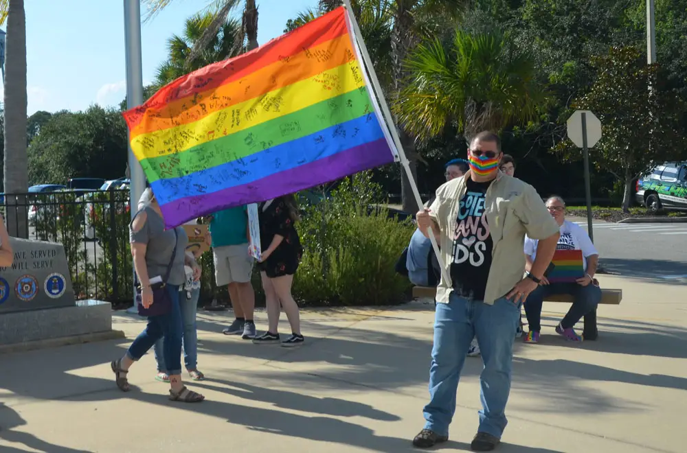 Randall Bertrand, the author, at a demonstration for transgender rights before a school board meeting last year. (© FlaglerLive)