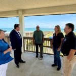 U.S. Rep. Randy Fine, second from left, at Bay Drive just before the tour down the shore for a look at the dunes and the erosion, with--from left--County Coastal Engineer Ansley Wren-Key, Deputy County Administrator Jorge Salinas, County Administrator Heidi Petito and County Commission Chair Andy Dance. (Flagler County)