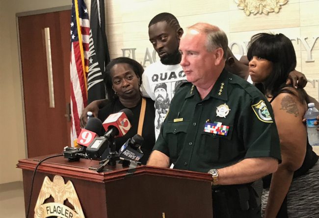 Sheriff Rick Staly was flanked by members of Ahmad Rashad Laster's family this afternoon as he announced the arrest of Laster's alleged murderer. (© FlaglerLive)