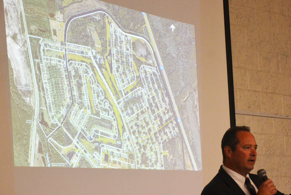 Ray Tyner, Palm Coast's Deputy Chief Development Officer, speaking to residents about the Matanzas golf course proposal at a neighborhood meeting in December. (© FlaglerLive)
